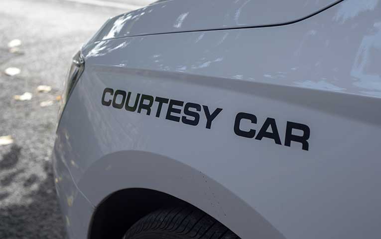 Courtesy cars are often available for customers at repair shops while their own car is being repaired.