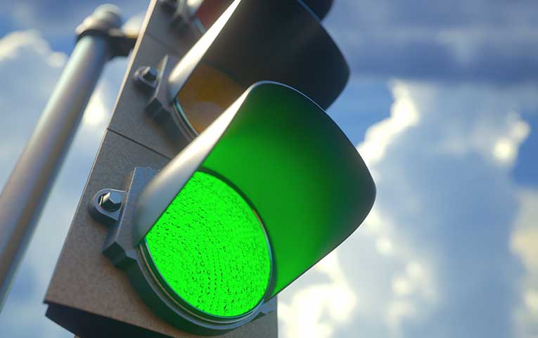 A green light means you have right of way - but only if you can cross the intersection - your vehicle is not allowed to block an intersection.